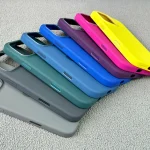 Apple silicone phone case with camera button on display