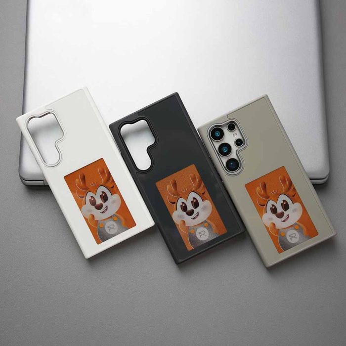 Three colors of Samsung NFC smart ink phone case are placed next to the computer.
