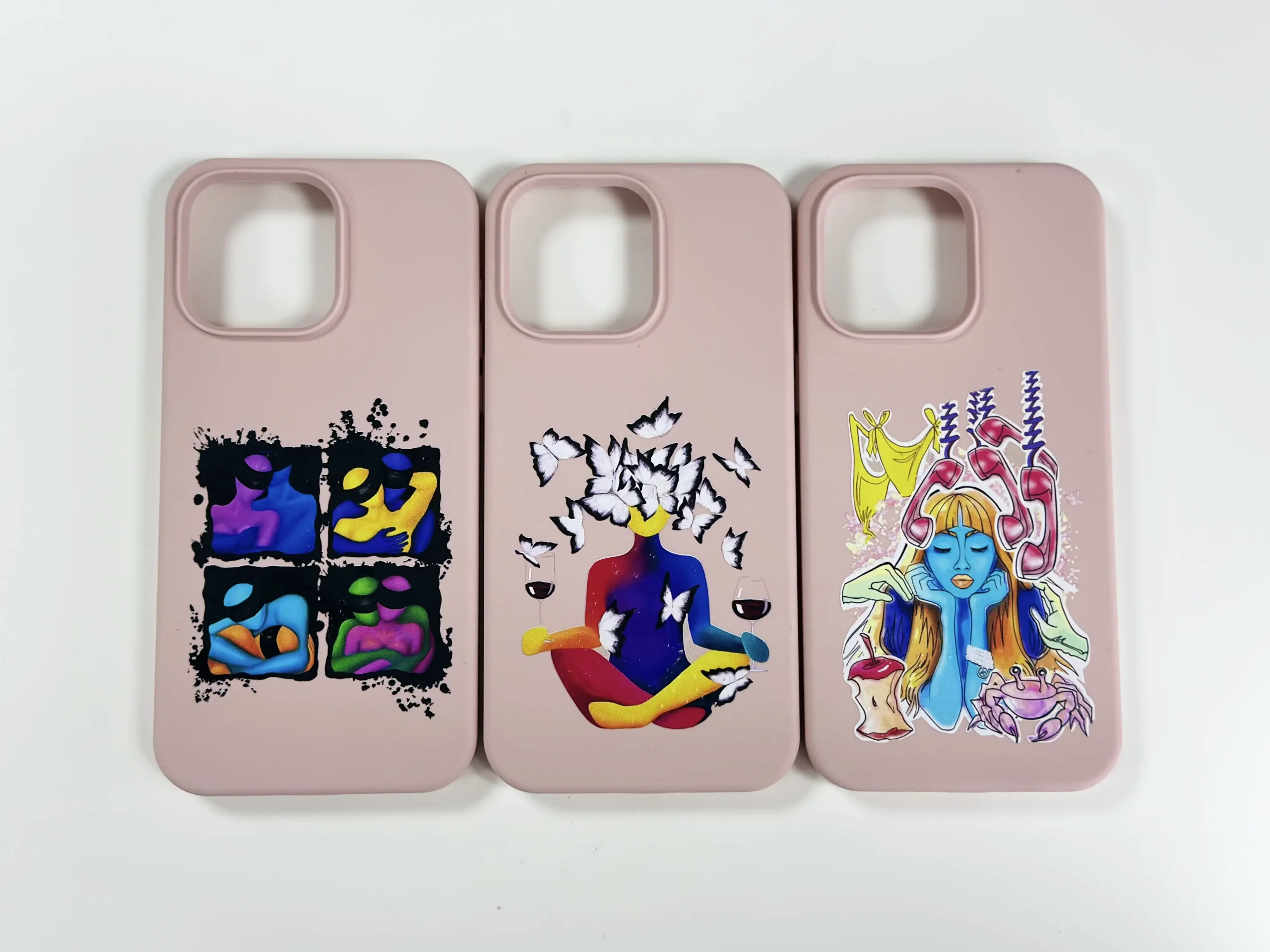 Custom silicone phone case iphone 14 options: three pink iphone 14 silicone phone cases with vibrant abstract artwork designs